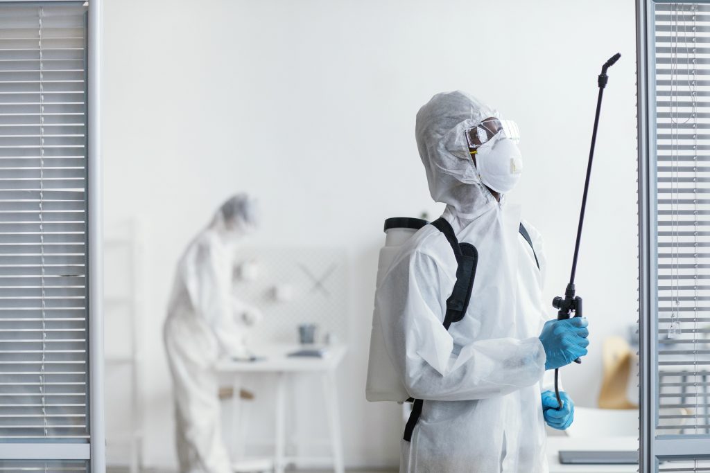 people disinfecting together dangerous area scaled