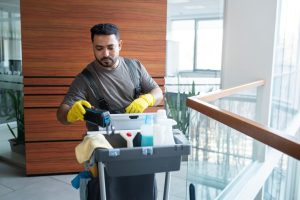 medium shot man walking with cleaning cart 23 2149345543